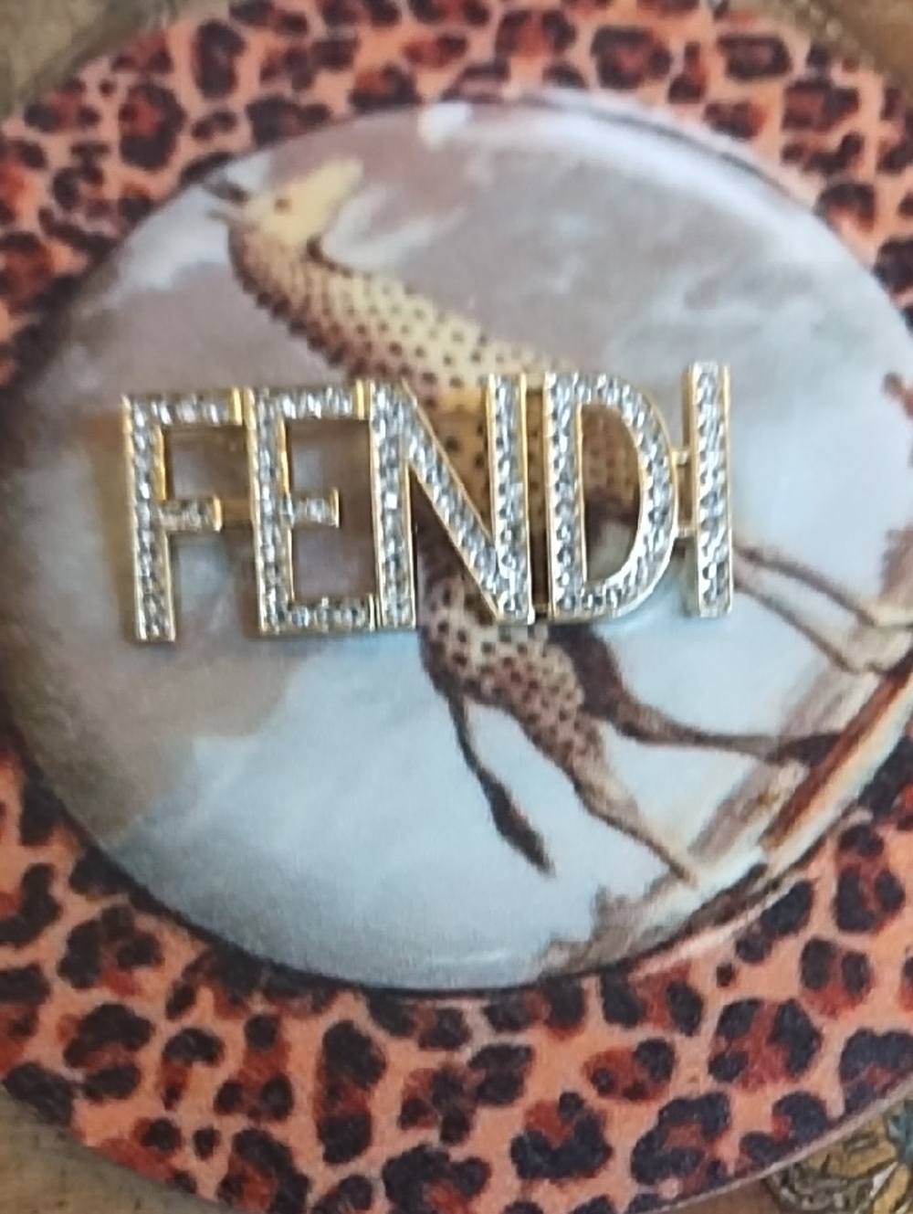 Gold Tone and Clear Rhinestone Logo Brooch